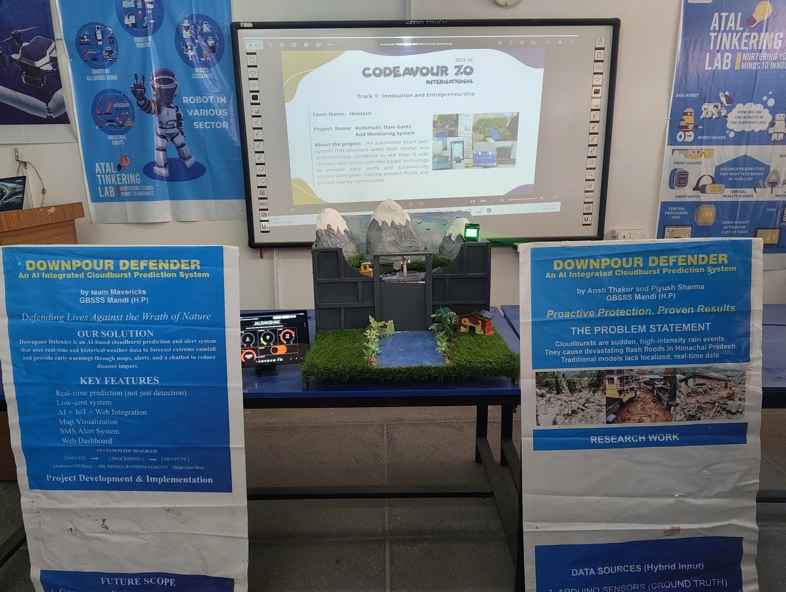 Full JalRakshak exhibit setup with posters and project model at Codeavour 7.0